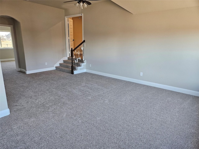 unfurnished living room featuring carpet flooring and ceiling fan