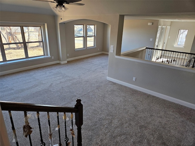 carpeted empty room with ceiling fan