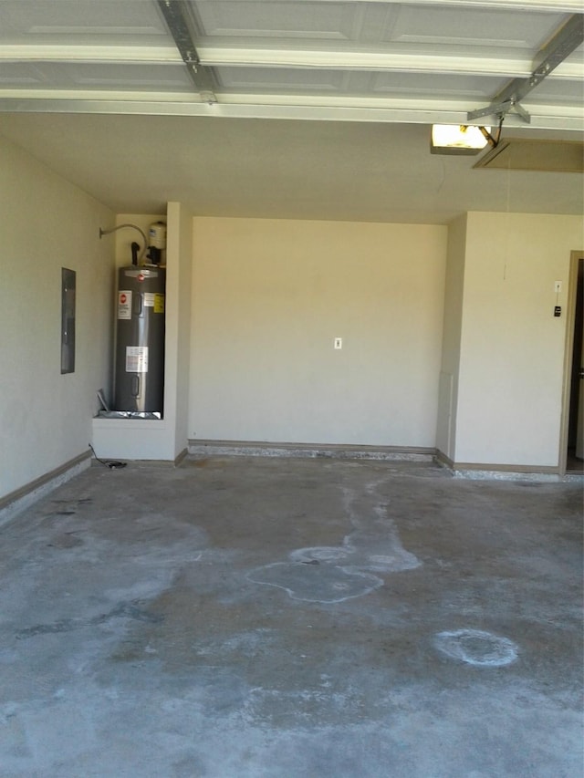 garage featuring a garage door opener, electric panel, and water heater