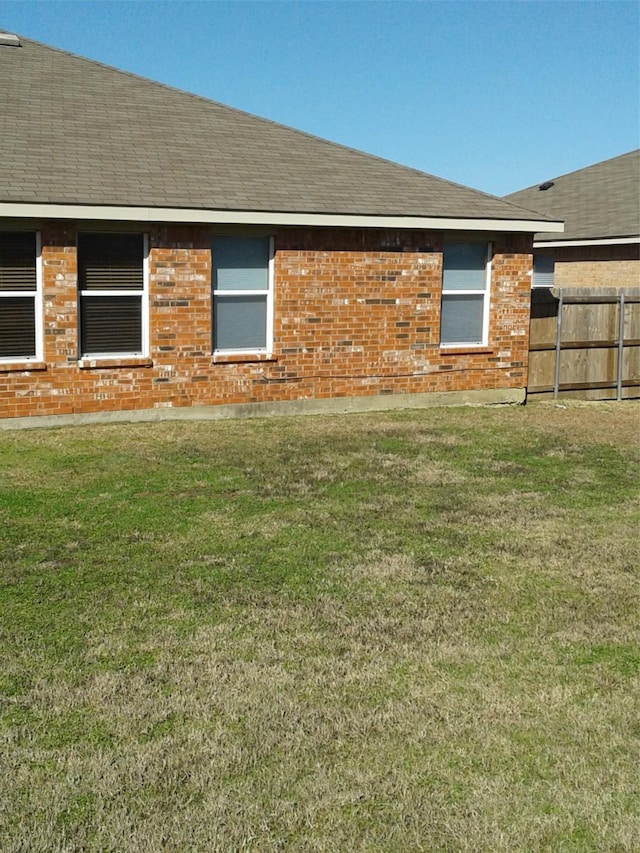 view of home's exterior featuring a yard