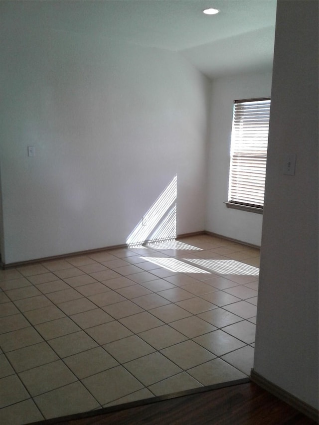 unfurnished room with tile patterned floors