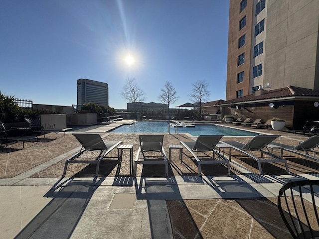 view of swimming pool featuring a patio