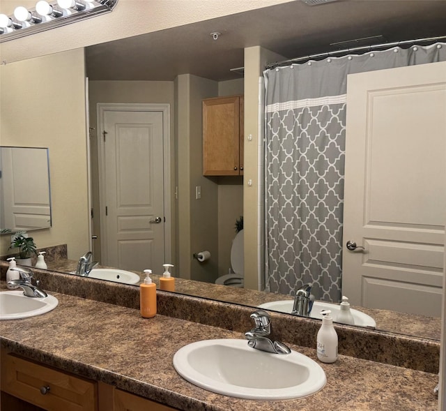 bathroom with vanity and curtained shower