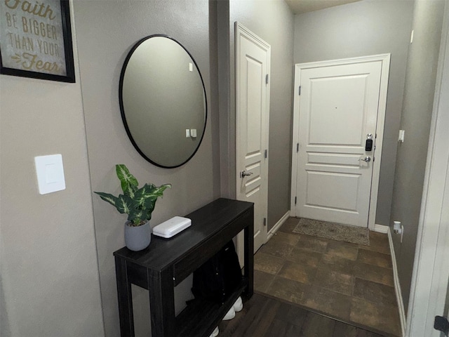 doorway with dark hardwood / wood-style floors