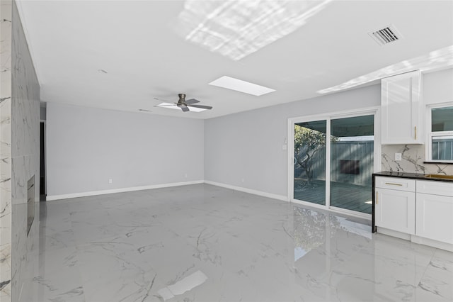 kitchen with sink, stainless steel dishwasher, white cabinets, and island exhaust hood