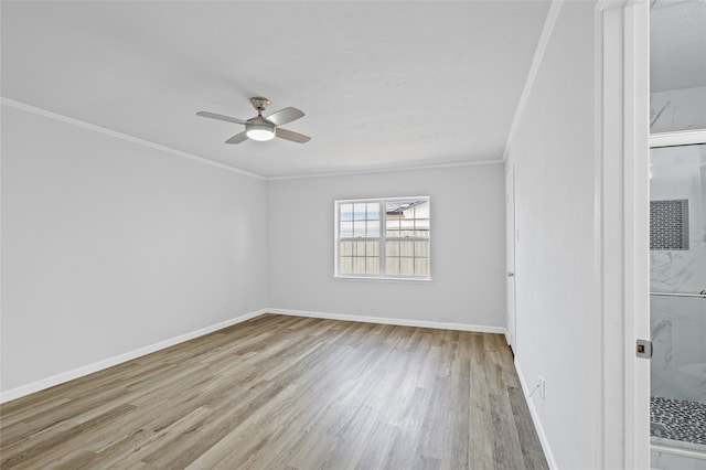 empty room with crown molding, light hardwood / wood-style floors, and ceiling fan