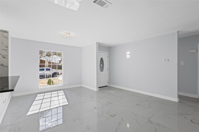 3521 Post Oak Rd, Garland, TX 75044 - entrance foyer with marble look tile flooring and baseboards