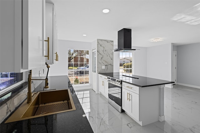 3521 Post Oak Rd, Garland, TX 75044 - kitchen with island exhaust hood, stainless steel range with electric cooktop, dark countertops, light marble finish flooring, and white cabinets