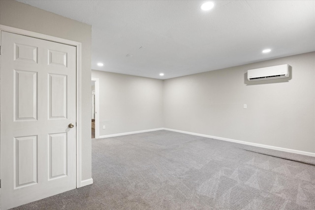 basement with carpet flooring and an AC wall unit