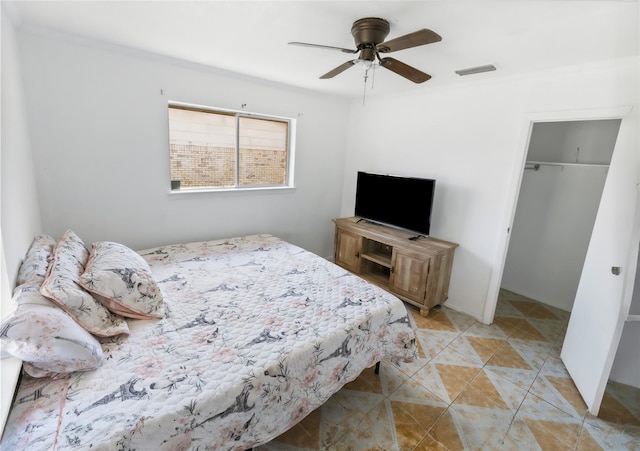 bedroom with light tile patterned floors, ceiling fan, and a closet