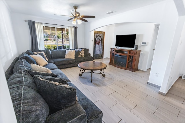 living room featuring ceiling fan