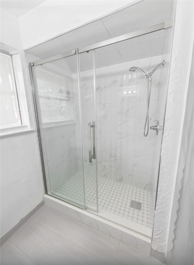 bathroom featuring walk in shower