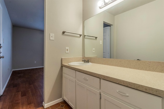 bathroom featuring hardwood / wood-style flooring and vanity