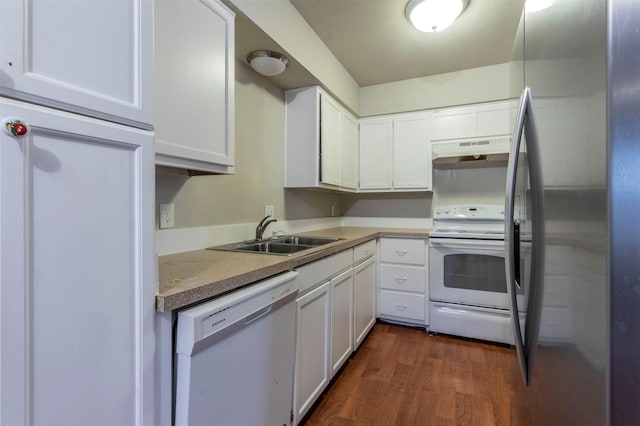 kitchen with dark hardwood / wood-style flooring, sink, white appliances, and white cabinets