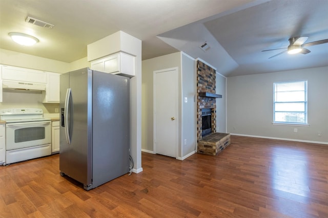 kitchen with white electric stove, white cabinetry, a large fireplace, stainless steel fridge with ice dispenser, and dark wood-type flooring