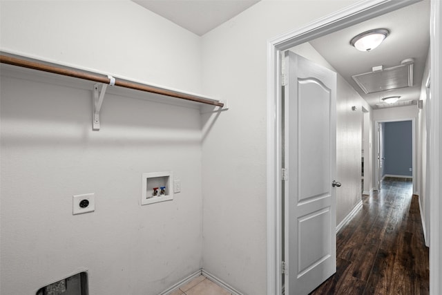 clothes washing area featuring electric dryer hookup, dark hardwood / wood-style floors, and washer hookup