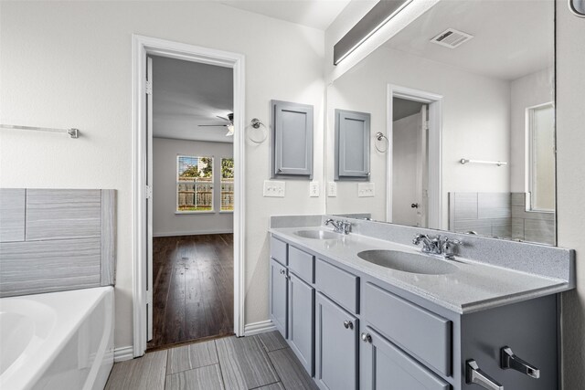 bathroom featuring an enclosed shower, vanity, and toilet