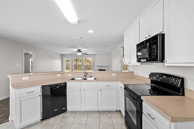 kitchen featuring sink, ceiling fan, black appliances, white cabinets, and kitchen peninsula