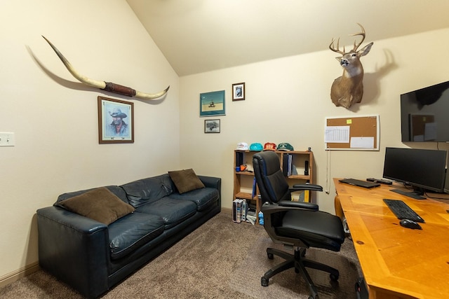 carpeted home office with lofted ceiling