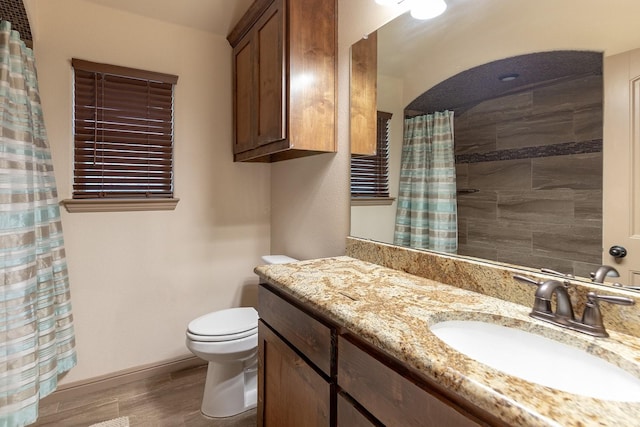 bathroom with vanity, hardwood / wood-style floors, toilet, and a shower with shower curtain