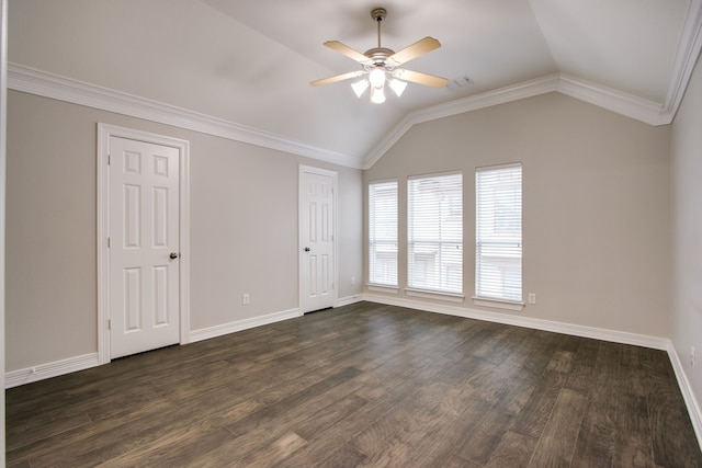 empty room featuring ceiling fan, lofted ceiling, dark hardwood / wood-style floors, and ornamental molding