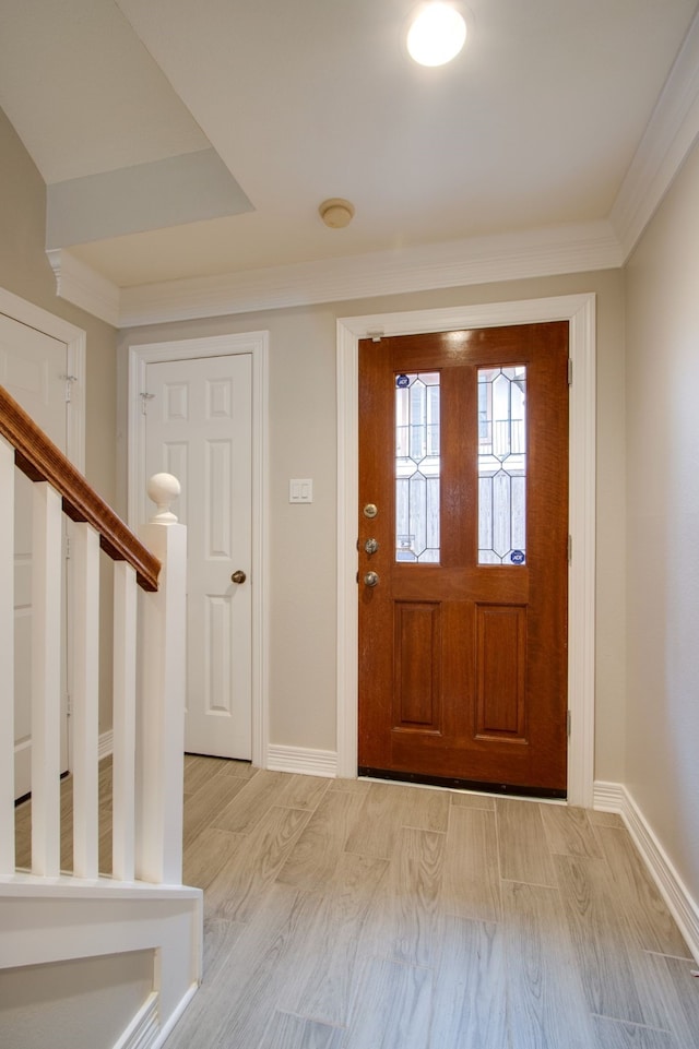 foyer entrance with light hardwood / wood-style floors