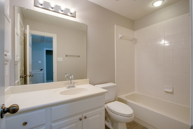 full bathroom featuring vanity, bathing tub / shower combination, and toilet