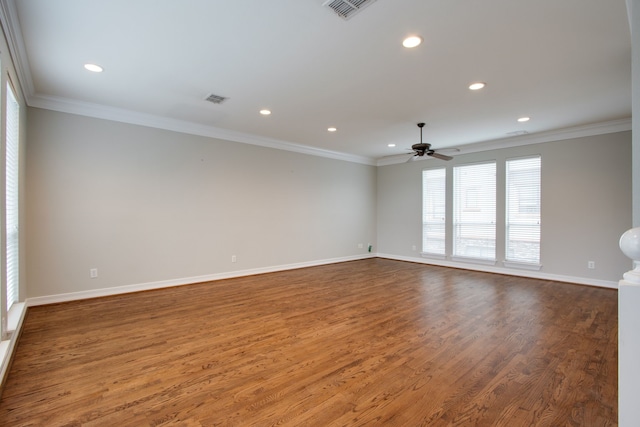 spare room featuring hardwood / wood-style flooring, ceiling fan, and ornamental molding