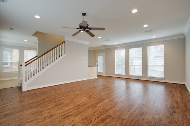 unfurnished living room with crown molding, ceiling fan, and dark hardwood / wood-style floors