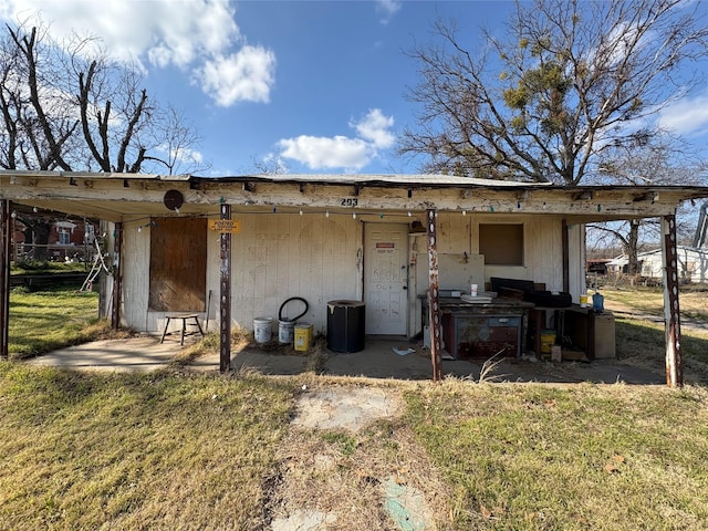 rear view of house featuring a yard