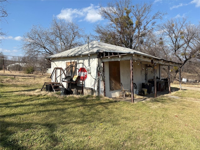 view of side of home featuring a lawn