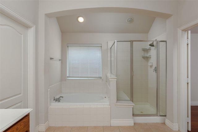 bathroom with tile patterned flooring, vanity, and independent shower and bath