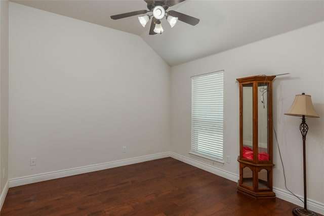 unfurnished room featuring dark wood-type flooring, ceiling fan, and vaulted ceiling