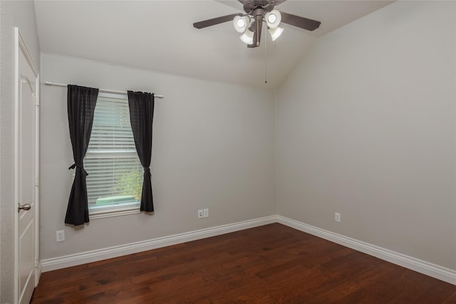 unfurnished room featuring vaulted ceiling, dark hardwood / wood-style floors, and ceiling fan