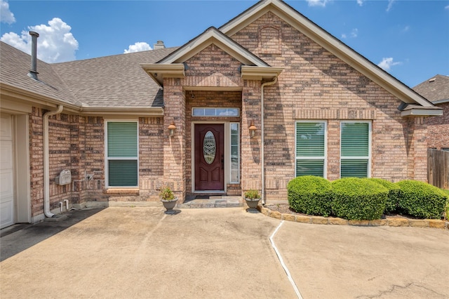 entrance to property featuring a patio area