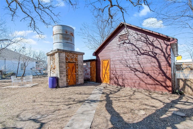 view of side of property featuring an outdoor structure