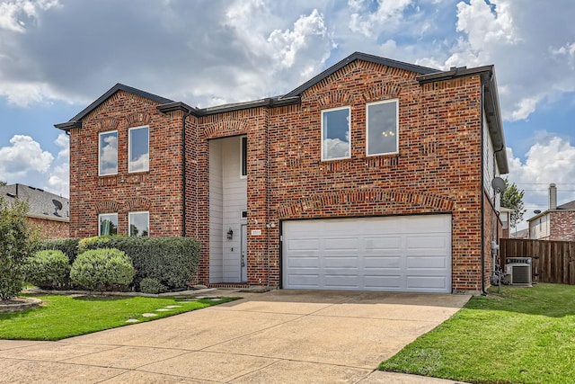 view of front of home featuring cooling unit, a garage, and a front lawn