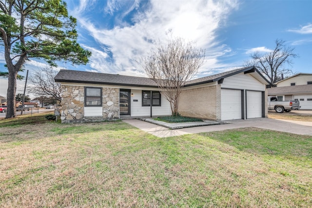 ranch-style house featuring a garage and a front yard