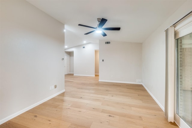 unfurnished room featuring vaulted ceiling, ceiling fan, and light hardwood / wood-style flooring