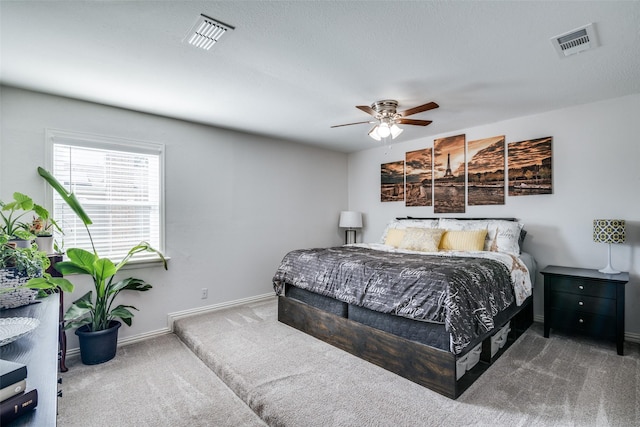 bedroom with ceiling fan and carpet