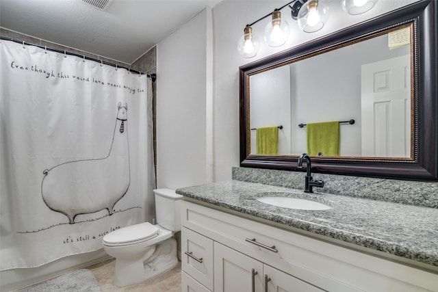 bathroom featuring vanity, toilet, and walk in shower