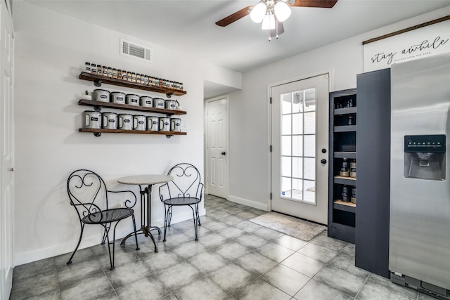 dining space featuring ceiling fan