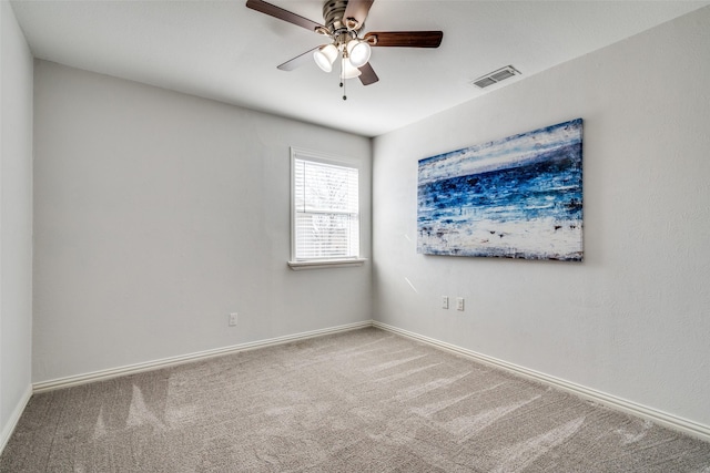 unfurnished room with ceiling fan and carpet flooring