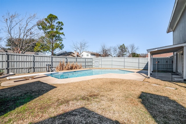 view of pool with a yard and a patio area