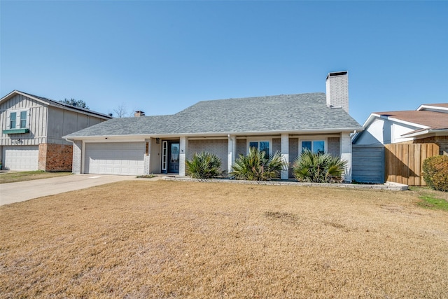 view of front of home with a garage and a front yard