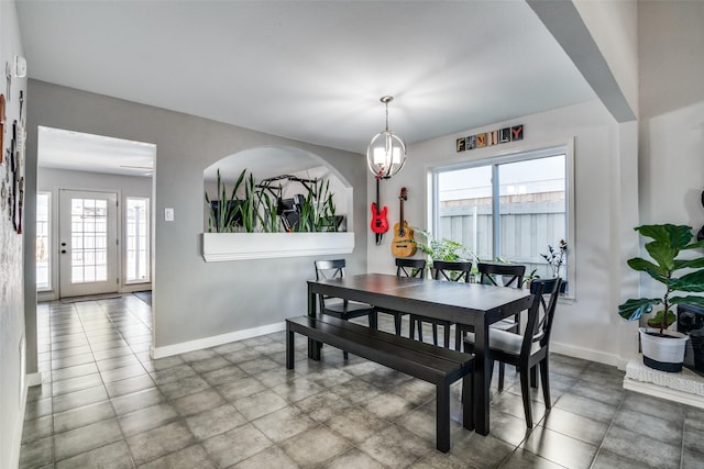 dining area with a notable chandelier and a healthy amount of sunlight