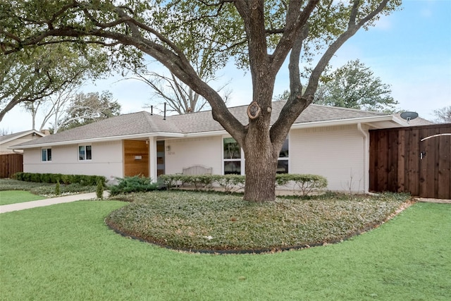 ranch-style house with a front yard