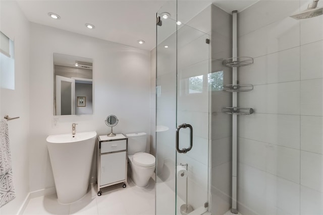 bathroom featuring vanity, toilet, and an enclosed shower