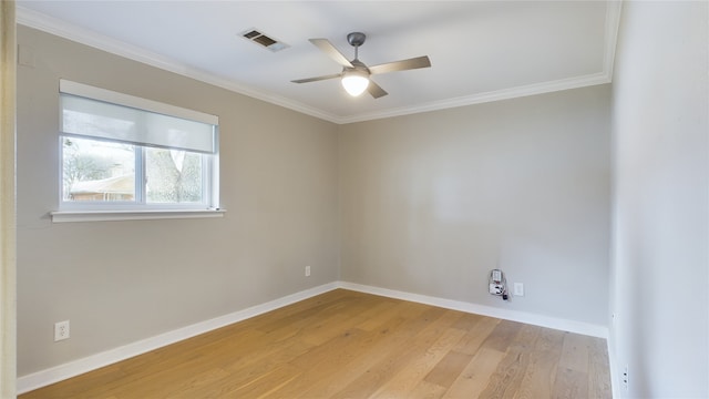 empty room with crown molding, ceiling fan, and light wood-type flooring