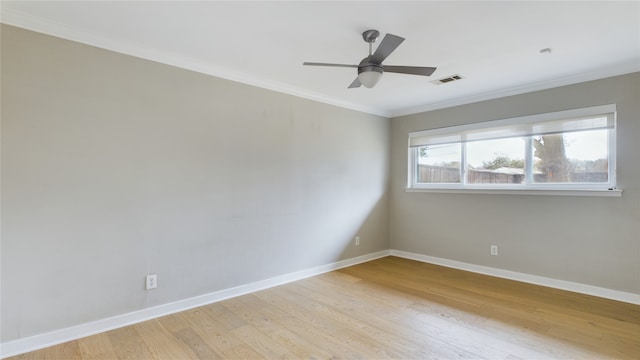 empty room with crown molding, ceiling fan, and light hardwood / wood-style flooring